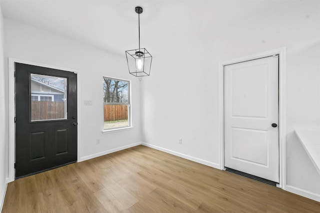 unfurnished dining area featuring light hardwood / wood-style floors