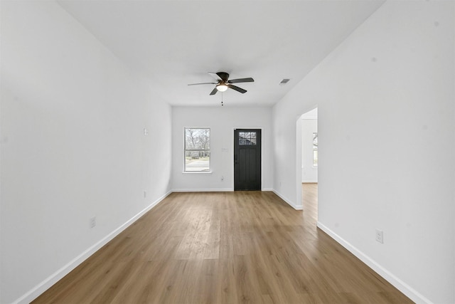 foyer with ceiling fan and light hardwood / wood-style flooring