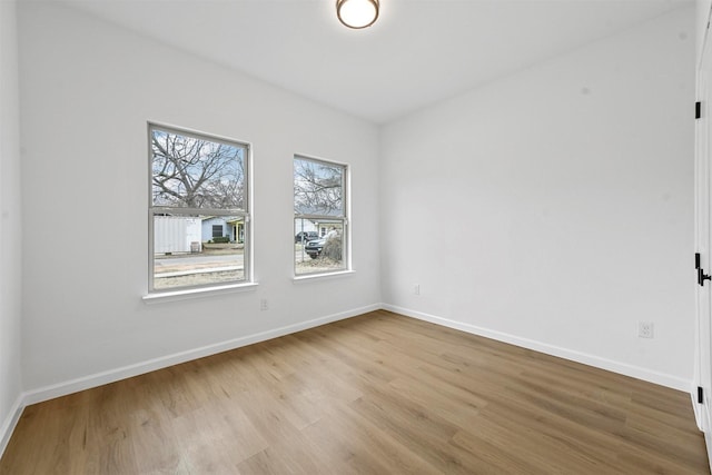 unfurnished room with light hardwood / wood-style flooring