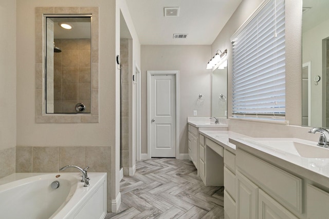 bathroom with parquet floors, vanity, and plus walk in shower