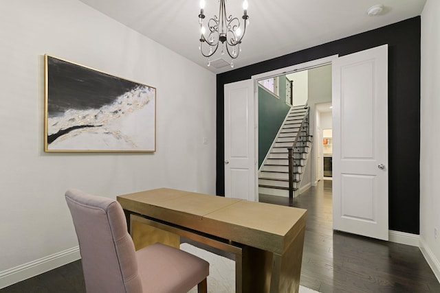 office area with a notable chandelier and dark hardwood / wood-style floors