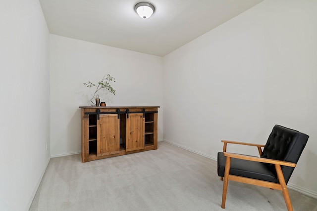 living area with light carpet