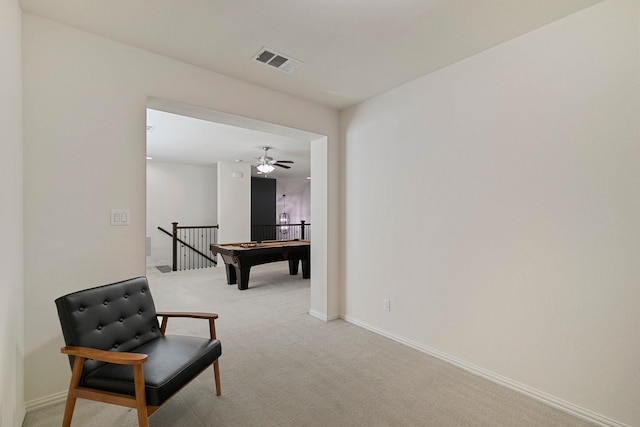 living area featuring light colored carpet