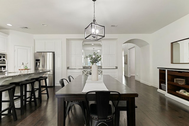 dining space featuring dark hardwood / wood-style flooring