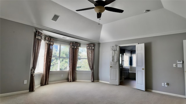 unfurnished bedroom with ceiling fan, light colored carpet, lofted ceiling, and connected bathroom