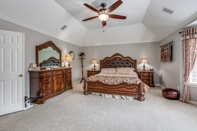 carpeted bedroom featuring crown molding, vaulted ceiling, a raised ceiling, and ceiling fan