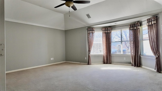 carpeted spare room with ceiling fan and vaulted ceiling