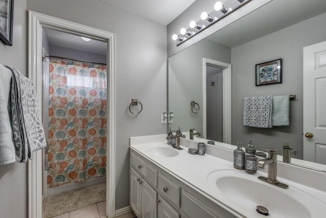 bathroom featuring tile patterned flooring, vanity, and a shower with shower curtain