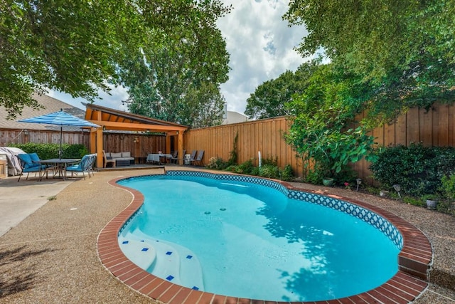 view of pool featuring a gazebo, an outdoor hangout area, and a patio area