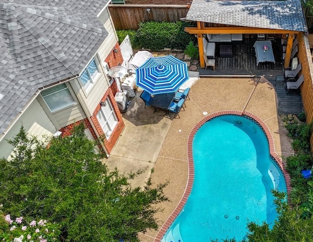 view of swimming pool with a patio