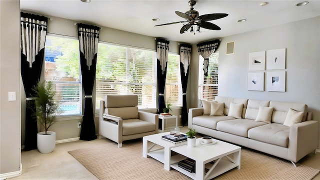 living room featuring ceiling fan and light carpet