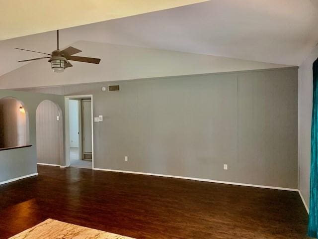 unfurnished room featuring vaulted ceiling, dark wood-type flooring, and ceiling fan