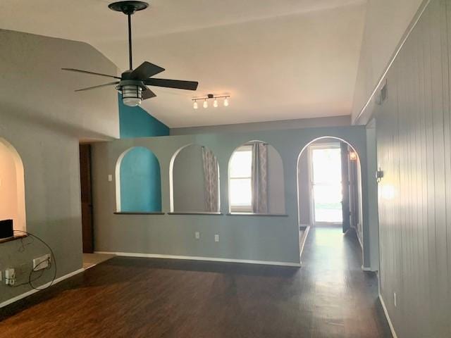 unfurnished living room with lofted ceiling, hardwood / wood-style flooring, and ceiling fan