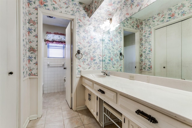 bathroom featuring tile patterned flooring and vanity