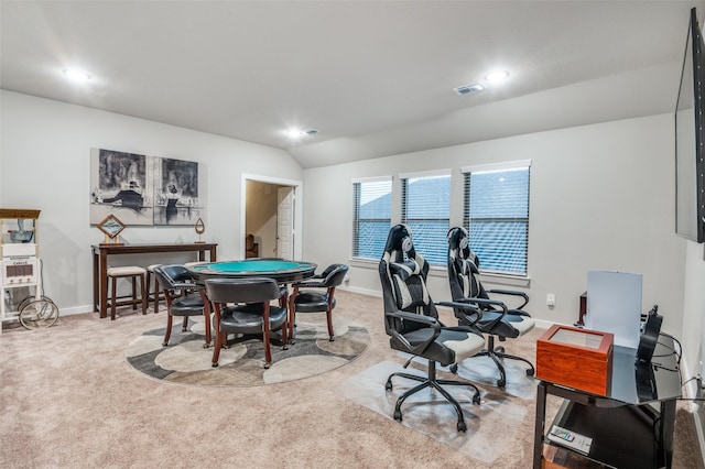 rec room featuring vaulted ceiling and light carpet