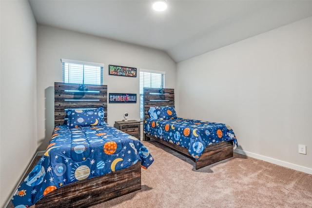 carpeted bedroom with vaulted ceiling