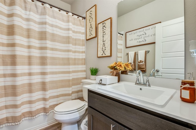 full bathroom with vanity, wood-type flooring, shower / bath combo, and toilet