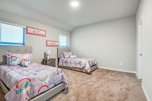 carpeted bedroom with vaulted ceiling