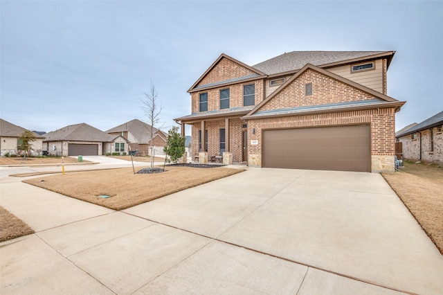 view of front of house featuring a garage and covered porch