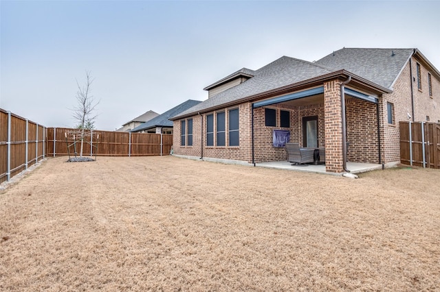 back of property with a patio area