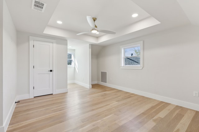 bonus room with a wealth of natural light, light hardwood / wood-style floors, and ceiling fan