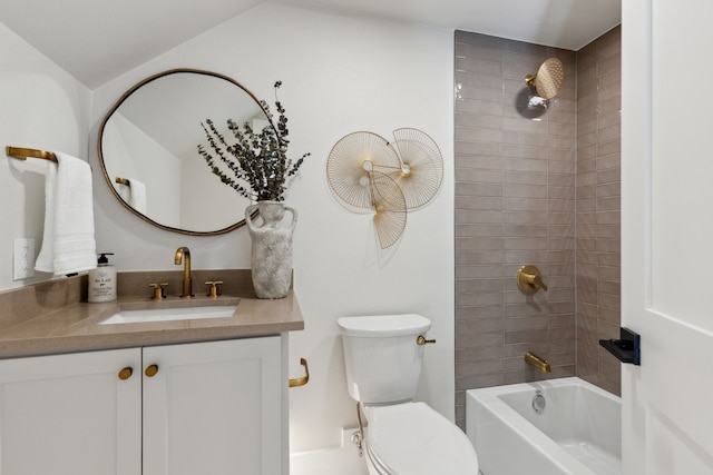 full bathroom with tiled shower / bath, vanity, and toilet