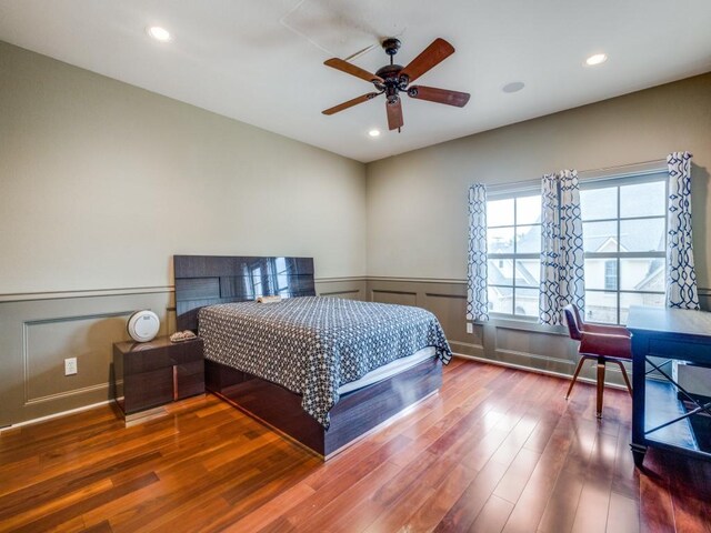 bedroom with hardwood / wood-style floors and ceiling fan