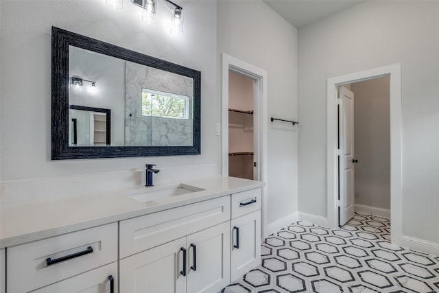 bathroom featuring vanity and a shower