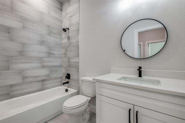 full bathroom with vanity, toilet, and tiled shower / bath