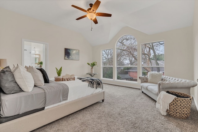 carpeted bedroom with lofted ceiling, connected bathroom, and ceiling fan