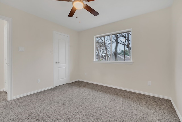 carpeted empty room with ceiling fan