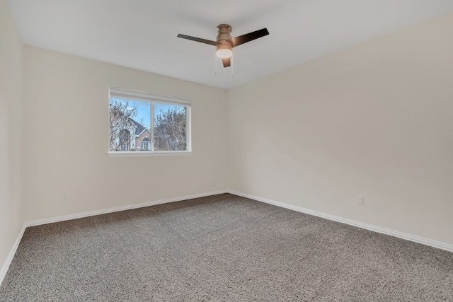 spare room with ceiling fan and carpet flooring