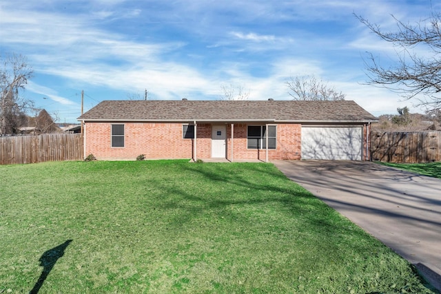 ranch-style house featuring a garage and a front yard