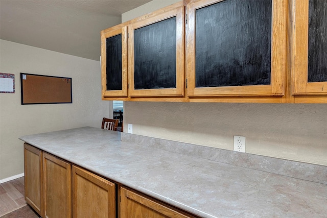 kitchen with dark hardwood / wood-style flooring