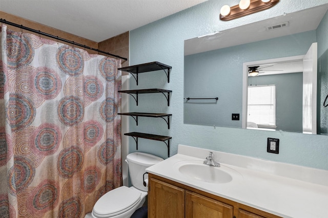 bathroom featuring vanity, ceiling fan, toilet, and a shower with shower curtain