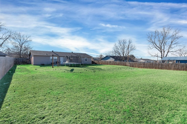 view of yard featuring a trampoline