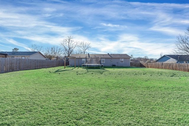 view of yard with a trampoline