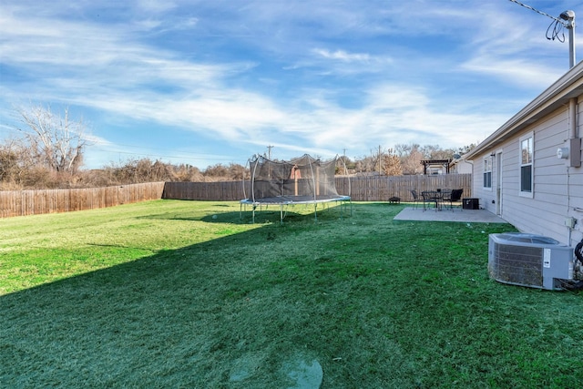 view of yard featuring a patio and central AC unit