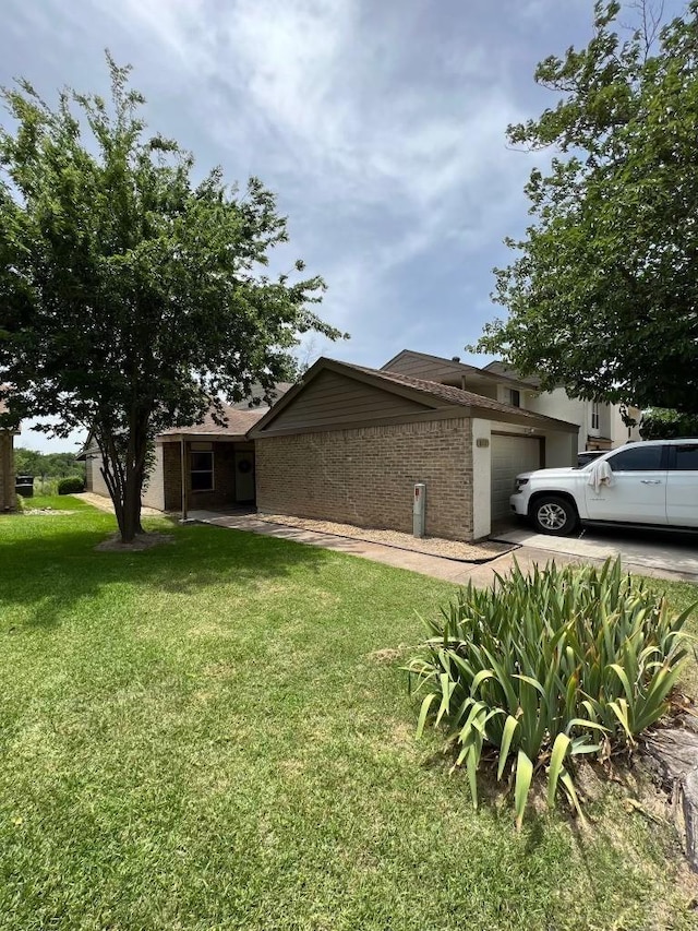 view of property exterior with a garage and a yard