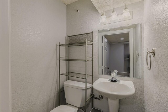 bathroom with sink and toilet