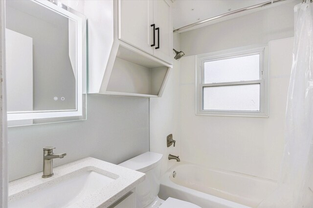 full bathroom with shower / bath combination with curtain, vanity, and toilet