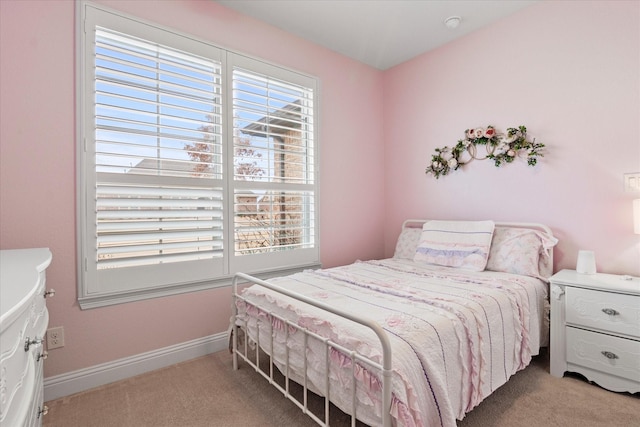 bedroom featuring light colored carpet