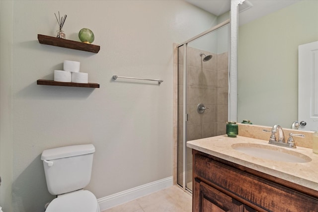 bathroom with vanity, a shower with shower door, tile patterned floors, and toilet