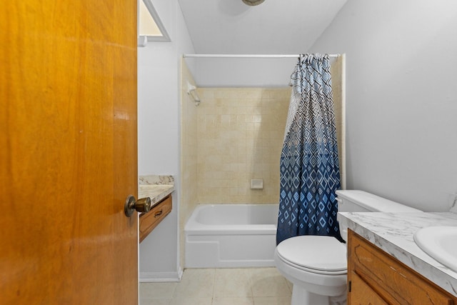 full bathroom featuring vanity, tile patterned floors, toilet, and shower / bath combo with shower curtain