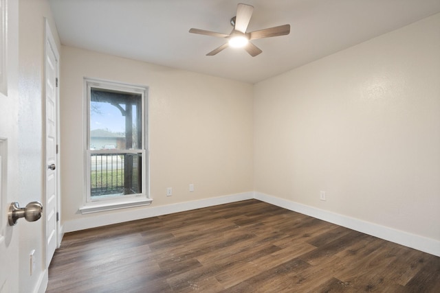 spare room featuring ceiling fan and dark hardwood / wood-style flooring