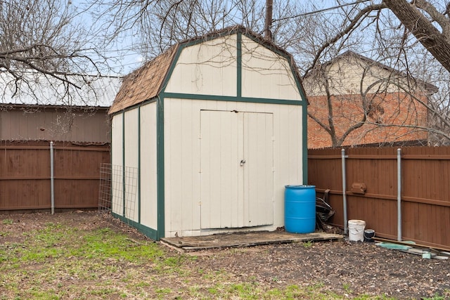 view of shed featuring a fenced backyard