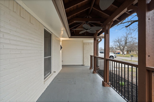 balcony with a porch, a residential view, and ceiling fan