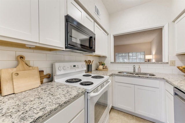 kitchen with electric stove, sink, white cabinetry, and dishwasher