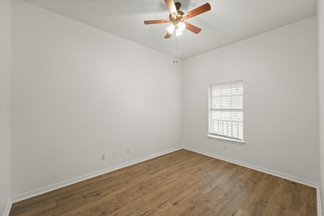 unfurnished room featuring dark hardwood / wood-style floors and ceiling fan