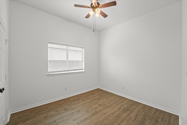 spare room featuring hardwood / wood-style floors and ceiling fan